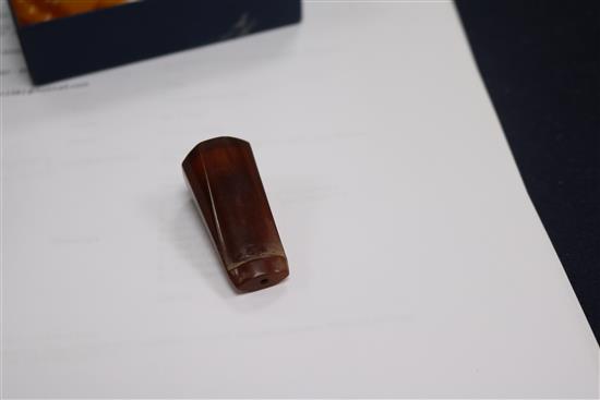 A single strand amber bead necklace, 28grms and an amber cigar holder.
